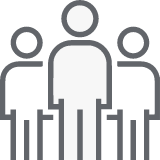 Group-14192@2x Simple icon showing three people, with one figure standing in front and two behind on either side.